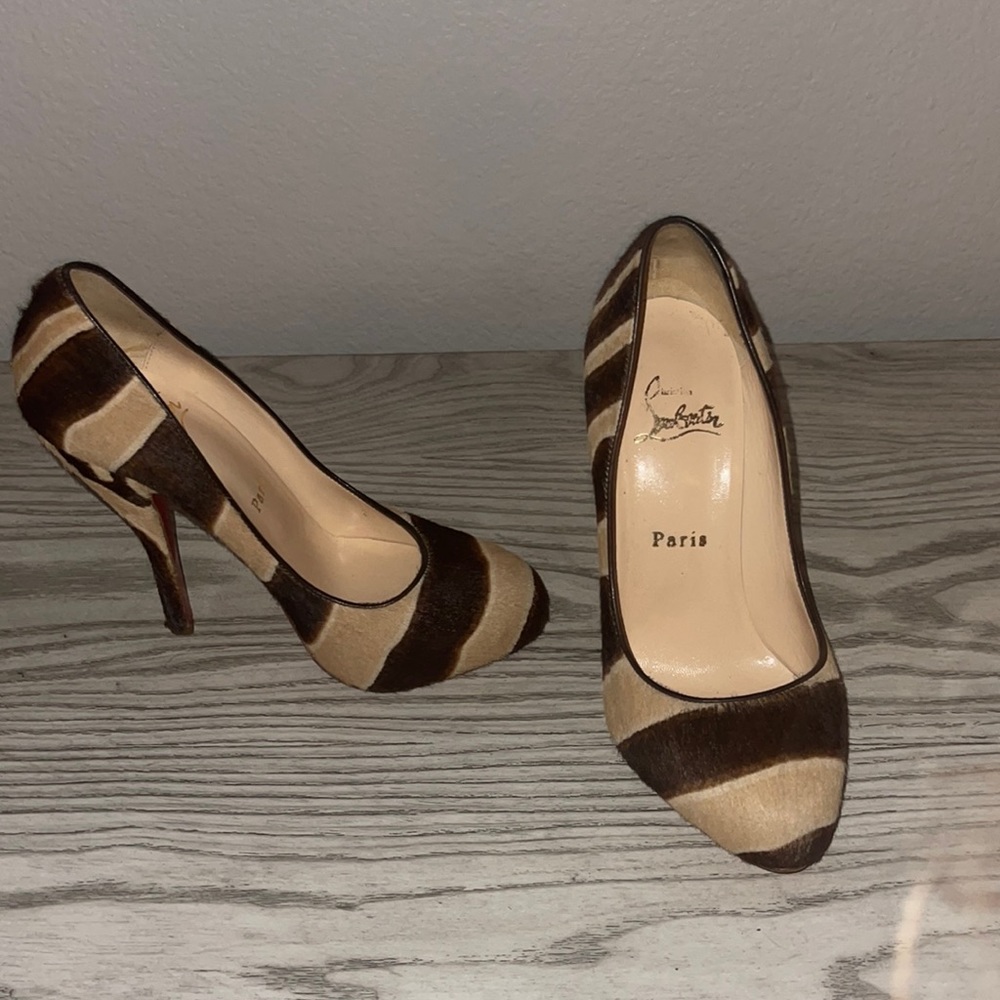 Beautiful calf hair animal print platform red bottoms!
